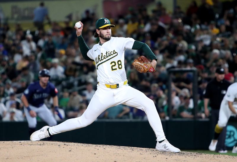May 5, 2025; West Sacramento, California, USA; Athletics pitcher Mitch Spence (28) throws against the Seattle Mariners during the eighth inning at Sutter Health Park. Mandatory Credit: Dennis Lee-Imagn Images