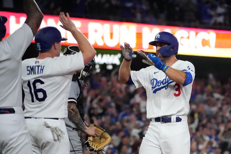 Jun 15, 2023; Los Angeles, California, USA; Los Angeles Dodgers third baseman Chris Taylor (3) celebrates with catcher Will Smith (16) after hitting a grand slam home run in the sixth inning against the Chicago White Sox at Dodger Stadium. Mandatory Credit: Kirby Lee-USA TODAY Sports