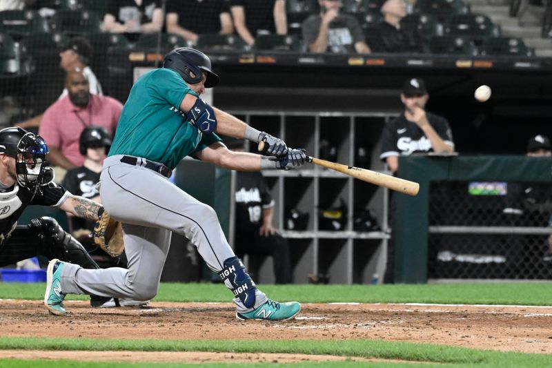 Aug 21, 2023; Chicago, Illinois, USA;  Seattle Mariners catcher Cal Raleigh (29) hits a three run home run against the Chicago White Sox during the eighth inning at Guaranteed Rate Field. Mandatory Credit: Matt Marton-USA TODAY Sports