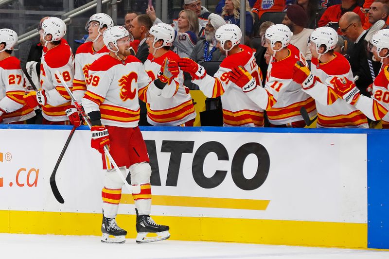 Oct 13, 2024; Edmonton, Alberta, CAN; The Calgary Flames celebrate a goal scored by forward Antony Mantha (39) during the third period against the Edmonton Oilers at Rogers Place. Mandatory Credit: Perry Nelson-Imagn Images