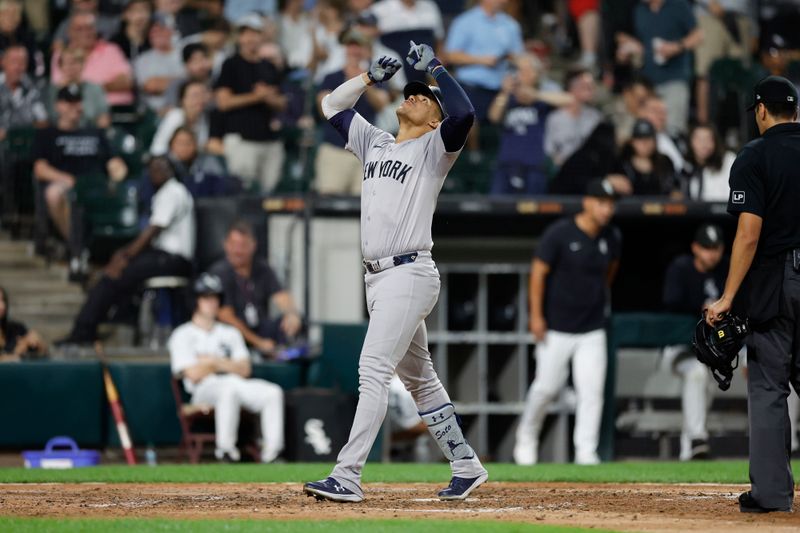 Aug 13, 2024; Chicago, Illinois, USA; New York Yankees outfielder Juan Soto (22) celebrates as he crosses home plate after hitting a solo home run against the Chicago White Sox during the seventh inning at Guaranteed Rate Field. Mandatory Credit: Kamil Krzaczynski-USA TODAY Sports