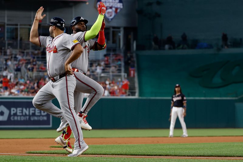 Jun 6, 2024; Washington, District of Columbia, USA; Atlanta Braves designated hitter Marcell Ozuna (20) celebrates with Braves third base coach Matt Tuiasosopo (89) while rounding the bases after hitting a two run home run against the Washington Nationals during the eighth inning at Nationals Park. Mandatory Credit: Geoff Burke-USA TODAY Sports