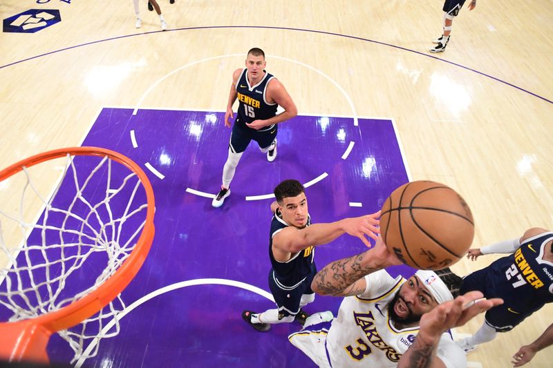 LOS ANGELES, CA - APRIL 27: Anthony Davis #3 of the Los Angeles Lakers drives to the basket during the game against the Denver Nuggets during Round 1 Game 4 of the 2024 NBA Playoffs on April 27, 2024 at Crypto.Com Arena in Los Angeles, California. NOTE TO USER: User expressly acknowledges and agrees that, by downloading and/or using this Photograph, user is consenting to the terms and conditions of the Getty Images License Agreement. Mandatory Copyright Notice: Copyright 2024 NBAE (Photo by Adam Pantozzi/NBAE via Getty Images)