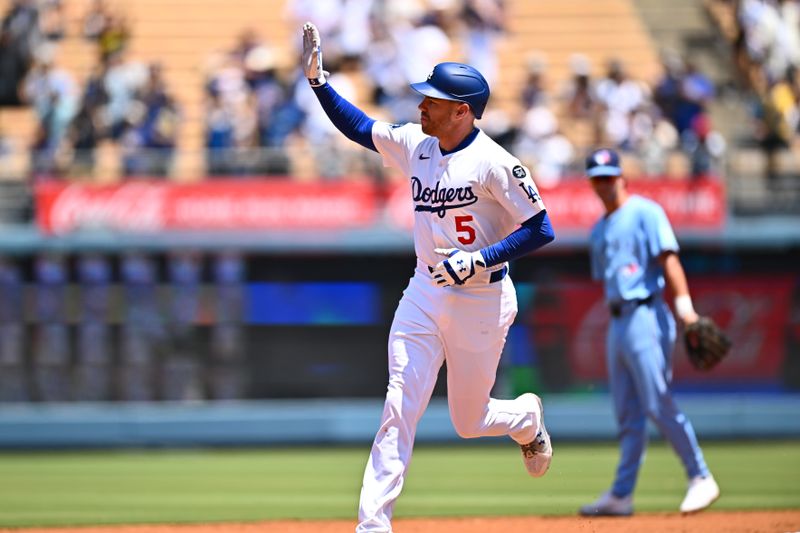 Aug 10, 2025; Los Angeles, California, USA; Los Angeles Dodgers first baseman Freddie Freeman (5) waves as he circles the bases after hitting a solo home run during the first inning against the Toronto Blue Jays at Dodger Stadium. Mandatory Credit: Jonathan Hui-Imagn Images