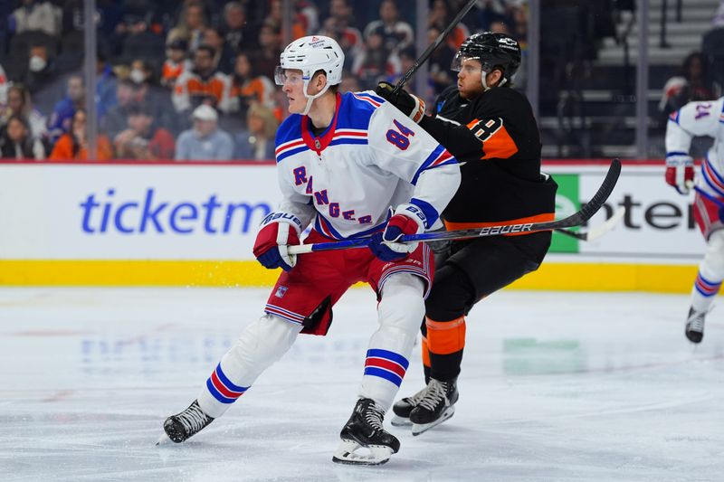 Nov 29, 2024; Philadelphia, Pennsylvania, USA; New York Rangers center Adam Edstrom (84) battles for position against Philadelphia Flyers defenseman Cam York (8) in the second period at Wells Fargo Center. Mandatory Credit: Kyle Ross-Imagn Images