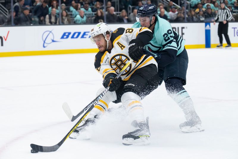 Feb 23, 2023; Seattle, Washington, USA; Boston Bruins forward David Pastrnak (88) skates against Seattle Kraken defenseman Vince Dunn (29) during the second period at Climate Pledge Arena. Mandatory Credit: Stephen Brashear-USA TODAY Sports