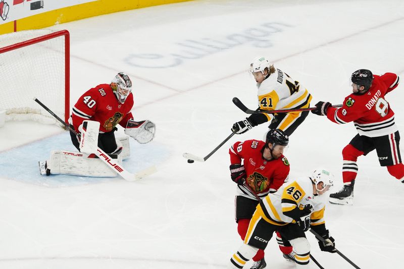 Dec 28, 2025; Chicago, Illinois, USA; Pittsburgh Penguins right wing Ville Koivunen (41) shoots the puck on Chicago Blackhawks goaltender Arvid Soderblom (40) during the second period at United Center. Mandatory Credit: David Banks-Imagn Images