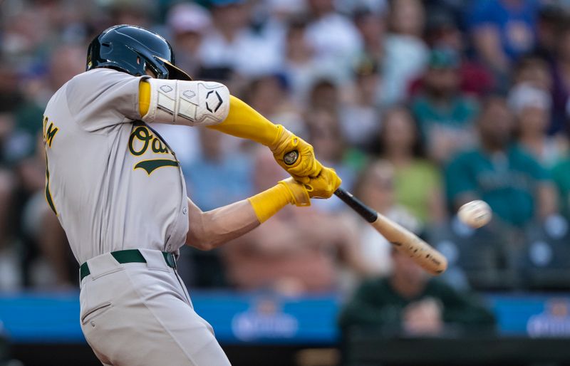 May 11, 2024; Seattle, Washington, USA; Oakland Athletics first baseman Tyler Soderstrom (21) hits a double during the sixth inning against the Seattle Mariners at T-Mobile Park. Mandatory Credit: Stephen Brashear-USA TODAY Sports