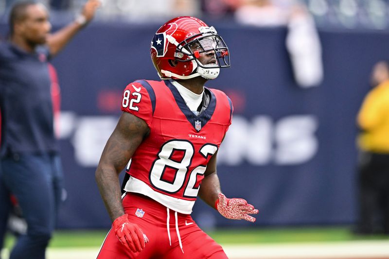 Houston Texans wide receiver Steven Sims (82) warms up prior to an NFL football game against the Jacksonville Jaguars, Sunday, Nov 26, 2023, in Houston. (AP Photo/Maria Lysaker)