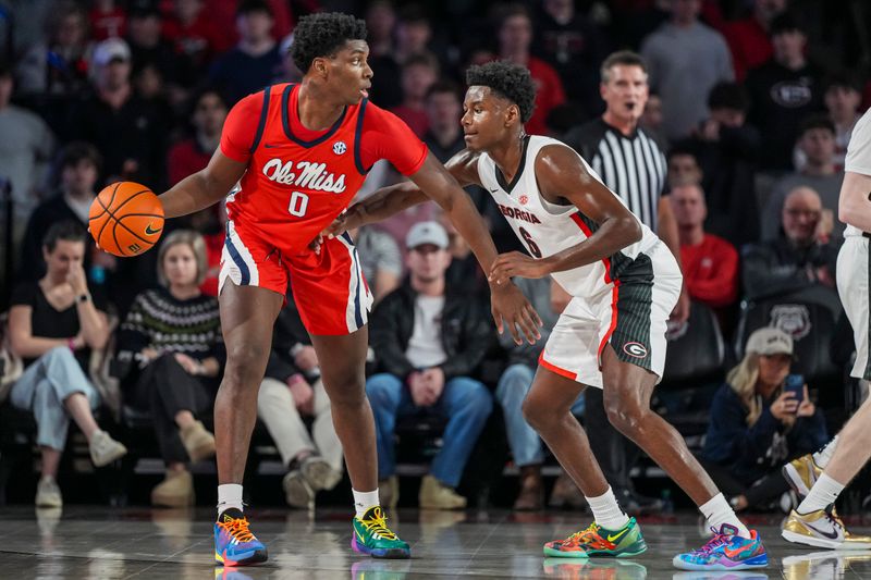Jan 14, 2026; Athens, Georgia, USA; Mississippi Rebels forward Malik Dia (0) dribbles against Georgia Bulldogs forward Kanon Catchings (6) during the first half at Stegeman Coliseum. Mandatory Credit: Dale Zanine-Imagn Images
