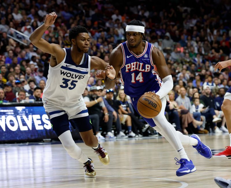 DES MOINES, IOWA - OCTOBER 11: Ricky Council IV #14 of the Philadelphia 76ers drives the ball as PJ Dozier #35 of the Minnesota Timberwolves defends in the second half of play during a preseason game at Wells Fargo Arena on October 11, 2024, in Des Moines, Iowa. The Minnesota Timberwolves won 121-111 over the Philadelphia 76ers. NOTE TO USER: User expressly acknowledges and agrees that, by downloading and or using this photograph, User is consenting to the terms and conditions of the Getty Images License Agreement (Photo by David K Purdy/Getty Images)