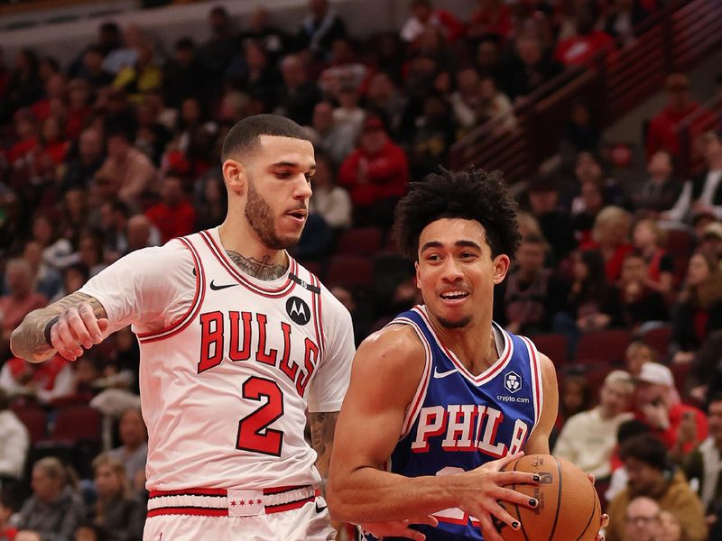 CHICAGO, ILLINOIS - DECEMBER 08: Jared McCain #20 of the Philadelphia 76ers drives to the basket against Lonzo Ball #2 of the Chicago Bulls during the first half at the United Center on December 08, 2024 in Chicago, Illinois. NOTE TO USER: User expressly acknowledges and agrees that, by downloading and or using this photograph, User is consenting to the terms and conditions of the Getty Images License Agreement.  (Photo by Michael Reaves/Getty Images)