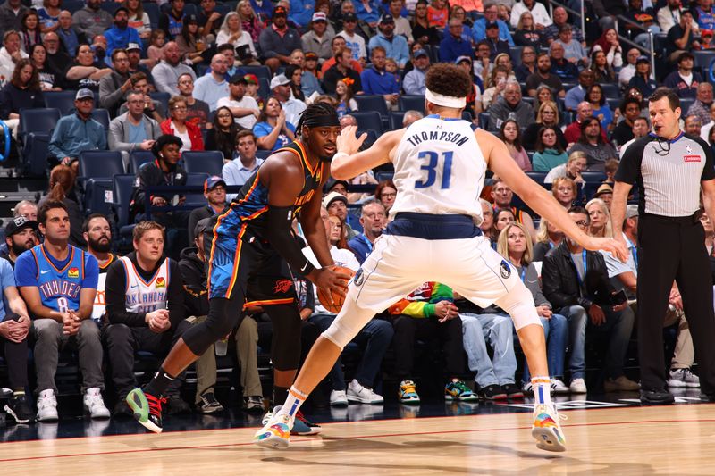 OKLAHOMA CITY, OK - NOVEMBER 17: Luguentz Dort #5 of the Oklahoma City Thunder handles the ball during the game against the Dallas Mavericks on November 17, 2024 at Paycom Center in Oklahoma City, Oklahoma. NOTE TO USER: User expressly acknowledges and agrees that, by downloading and or using this photograph, User is consenting to the terms and conditions of the Getty Images License Agreement. Mandatory Copyright Notice: Copyright 2024 NBAE (Photo by Zach Beeker/NBAE via Getty Images)