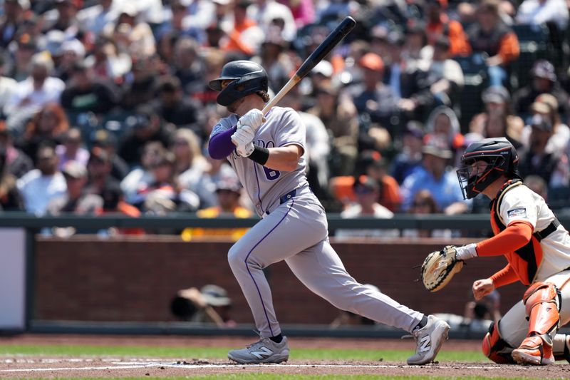 May 3, 2025; San Francisco, California, USA; Colorado Rockies shortstop Kyle Farmer (6) hits an RBI single against the San Francisco Giants during the sixth inning at Oracle Park. Mandatory Credit: Darren Yamashita-Imagn Images