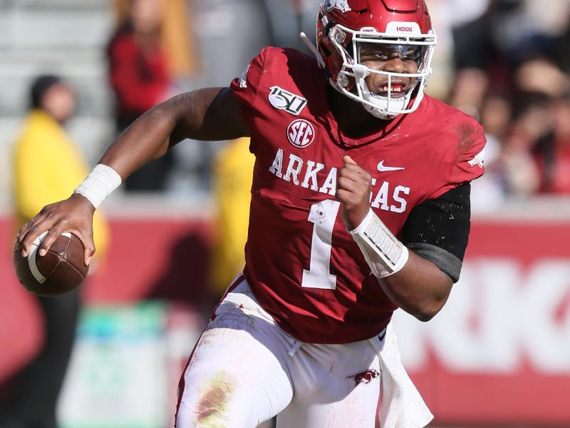 Nov 9, 2019; Fayetteville, AR, USA; Arkansas Razorbacks quarterback KJ Jefferson (1) rushes against the Western Kentucky Hilltoppers during the second half at Donald W. Reynolds Razorback Stadium. Western Kentucky won 45-19. Mandatory Credit: Nelson Chenault-USA TODAY Sports