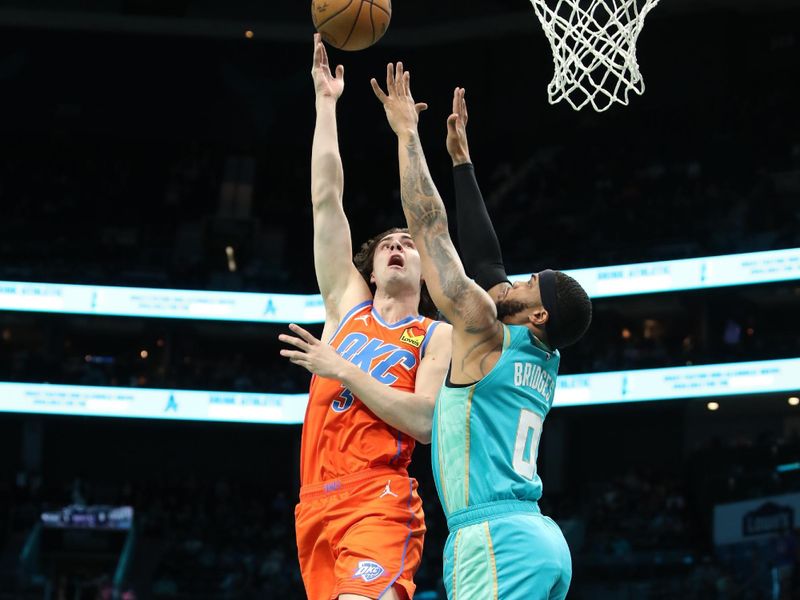 CHARLOTTE, NC - APRIL 7: Josh Giddey #3 of the Oklahoma City Thunder drives to the basket during the game against the Charlotte Hornets on April 7, 2024 at Spectrum Center in Charlotte, North Carolina. NOTE TO USER: User expressly acknowledges and agrees that, by downloading and or using this photograph, User is consenting to the terms and conditions of the Getty Images License Agreement.  Mandatory Copyright Notice:  Copyright 2024 NBAE (Photo by Brock Williams-Smith/NBAE via Getty Images)