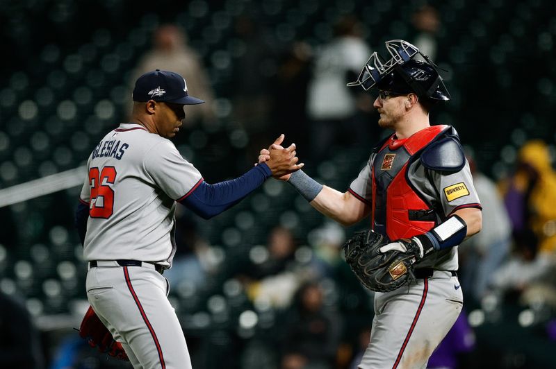Apr 28, 2025; Denver, Colorado, USA; Atlanta Braves relief pitcher Raisel Iglesias (26) celebrates with catcher Sean Murphy (12) after the game against the Colorado Rockies at Coors Field. Mandatory Credit: Isaiah J. Downing-Imagn Images