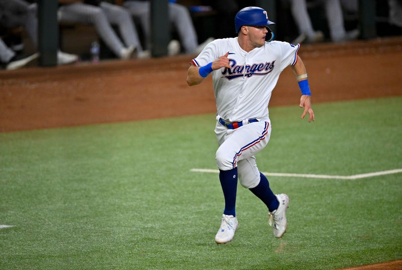 Aug 3, 2023; Arlington, Texas, USA; Texas Rangers third baseman Josh Jung (6) scores against the Chicago White Sox during the eighth inning at Globe Life Field. Mandatory Credit: Jerome Miron-USA TODAY Sports