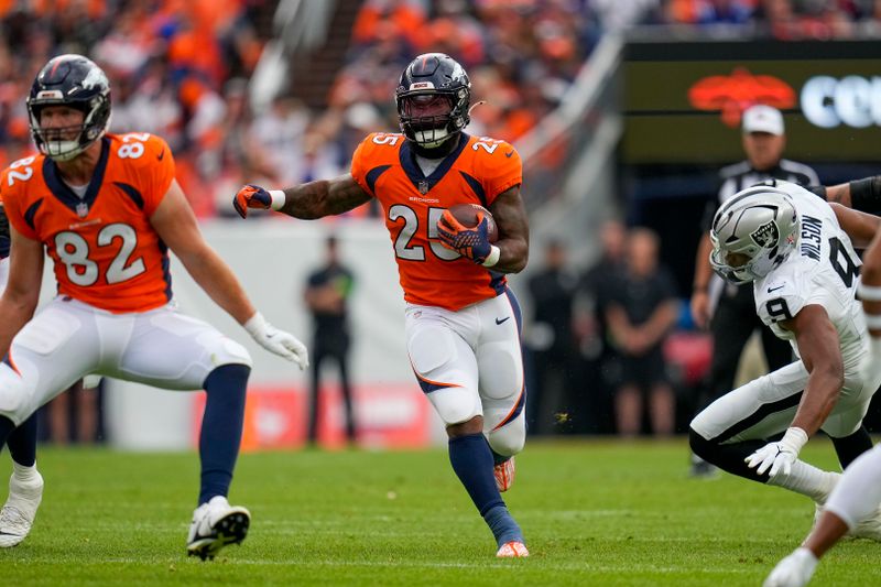 Denver Broncos running back Samaje Perine (25) runs against the Las Vegas Raiders uring an NFL football game Sunday, Sept. 10, 2023, in Denver. (AP Photo/Jack Dempsey)