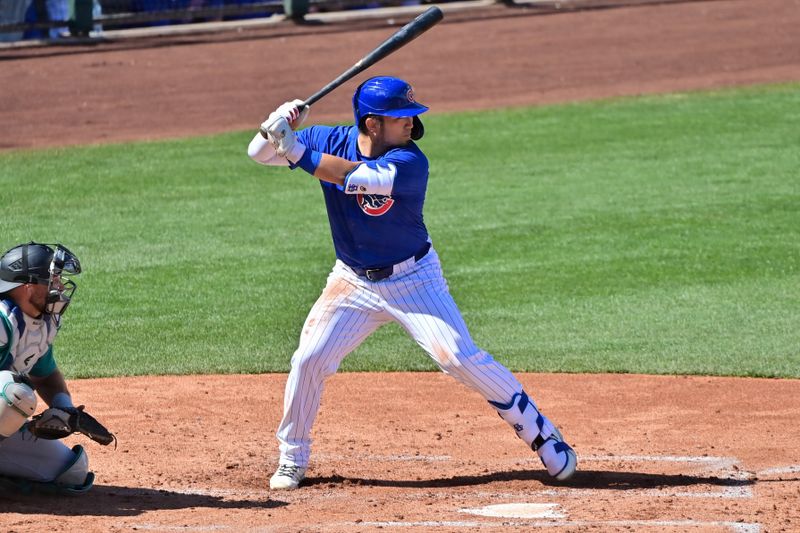 Mar 8, 2024; Mesa, Arizona, USA;  Chicago Cubs right fielder Seiya Suzuki (27) at bat in the second inning against the Seattle Mariners during a spring training game at Sloan Park. Mandatory Credit: Matt Kartozian-USA TODAY Sports