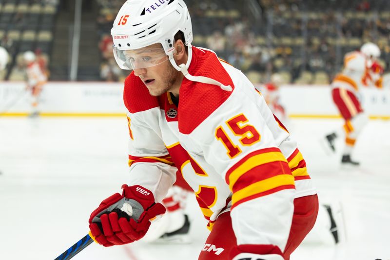 Oct 14, 2023; Pittsburgh, Pennsylvania, USA; Calgary Flames left winger Dryden Hunt (15) skates the puck during warm up before the game against the Pittsburgh Penguins at PPG Paints Arena. Mandatory Credit: Scott Galvin-USA TODAY Sports