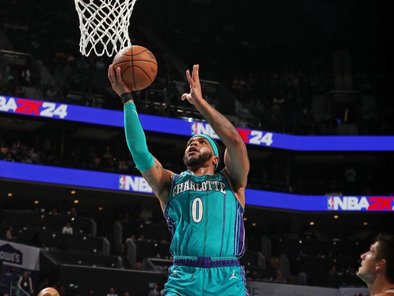 CHARLOTTE, NC - MARCH 15: Miles Bridges #0 of the Charlotte Hornets drives to the basket during the game against the Phoenix Suns on March 15, 2024 at Spectrum Center in Charlotte, North Carolina. NOTE TO USER: User expressly acknowledges and agrees that, by downloading and or using this photograph, User is consenting to the terms and conditions of the Getty Images License Agreement. Mandatory Copyright Notice: Copyright 2024 NBAE (Photo by Kent Smith/NBAE via Getty Images)