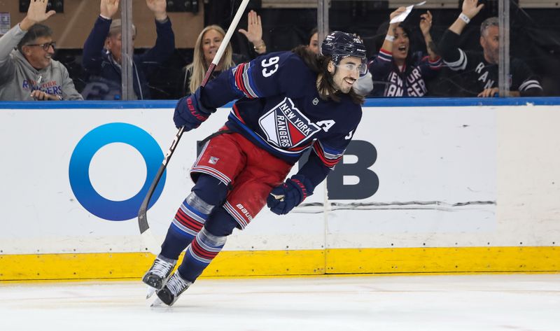 Nov 3, 2024; New York, New York, USA; New York Rangers center Mika Zibanejad (93) reacts after a goal by New York Rangers left wing Chris Kreider (not pictured) during the first period against the New York Islanders at Madison Square Garden. Mandatory Credit: Danny Wild-Imagn Images