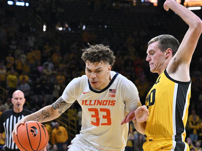 Mar 10, 2024; Iowa City, Iowa, USA; Illinois Fighting Illini forward Coleman Hawkins (33) goes to the basket as Iowa Hawkeyes forward Payton Sandfort (20) defends during the first half at Carver-Hawkeye Arena. Mandatory Credit: Jeffrey Becker-USA TODAY Sports