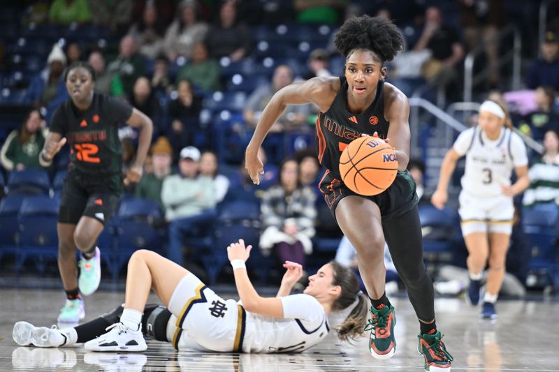 Jan 14, 2024; South Bend, Indiana, USA; Miami Hurricanes guard Jaida Patrick (5) steals the ball from Notre Dame Fighting Irish guard Sonia Citron (11) in the second half at the Purcell Pavilion. Mandatory Credit: Matt Cashore-USA TODAY Sports