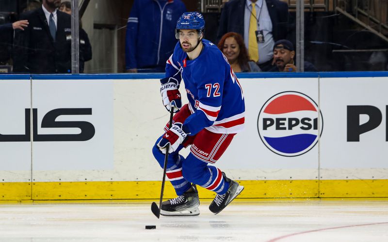 Sep 24, 2024; New York, New York, USA; New York Rangers center Filip Chytil (72) skates with the puck against the New York Islanders during the first period at Madison Square Garden. Mandatory Credit: Danny Wild-Imagn Images