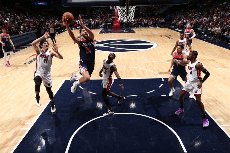 WASHINGTON, DC -? MARCH 31:  Anthony Gill #16 of the Washington Wizards drives to the basket during the game against the Miami Heat on March 31, 2024 at Capital One Arena in Washington, DC. NOTE TO USER: User expressly acknowledges and agrees that, by downloading and or using this Photograph, user is consenting to the terms and conditions of the Getty Images License Agreement. Mandatory Copyright Notice: Copyright 2024 NBAE (Photo by Kenny Giarla/NBAE via Getty Images)