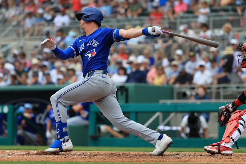 Feb 22, 2026; Fort Myers, Florida, USA;  Toronto Blue Jays first baseman Riley Triotta (87) doubles during the second inning against the Boston Red Sox at JetBlue Park at Fenway South. Mandatory Credit: Kim Klement Neitzel-Imagn Images