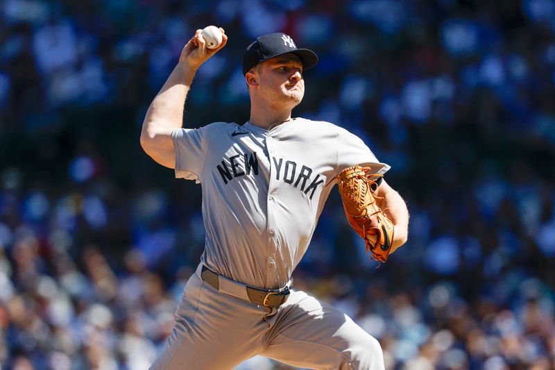 Sep 7, 2024; Chicago, Illinois, USA; New York Yankees starting pitcher Clarke Schmidt (36) delivers a pitch against the Chicago Cubs during the first inning at Wrigley Field. Mandatory Credit: Kamil Krzaczynski-Imagn Images