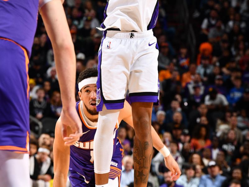 PHOENIX, AZ - FEBRUARY 13:  Malik Monk #0 of the Sacramento Kings shoots the ball during the game against the Phoenix Suns on February 13, 2024 at Footprint Center in Phoenix, Arizona. NOTE TO USER: User expressly acknowledges and agrees that, by downloading and or using this photograph, user is consenting to the terms and conditions of the Getty Images License Agreement. Mandatory Copyright Notice: Copyright 2024 NBAE (Photo by Barry Gossage/NBAE via Getty Images)