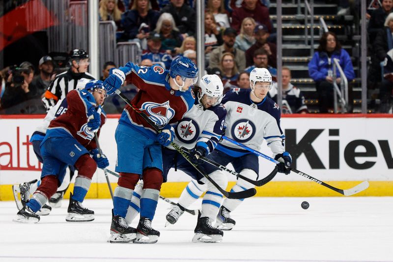 Apr 26, 2024; Denver, Colorado, USA; Colorado Avalanche left wing Artturi Lehkonen (62) and Winnipeg Jets left wing Alex Iafallo (9) battle for the puck in the first period in game three of the first round of the 2024 Stanley Cup Playoffs at Ball Arena. Mandatory Credit: Isaiah J. Downing-USA TODAY Sports