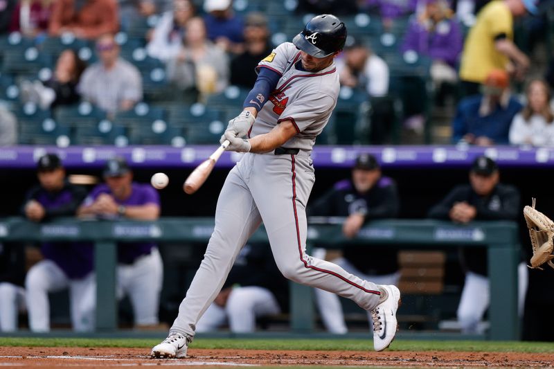 Apr 28, 2025; Denver, Colorado, USA; Atlanta Braves first baseman Matt Olson (28) hits a single in the second inning against the Colorado Rockies at Coors Field. Mandatory Credit: Isaiah J. Downing-Imagn Images