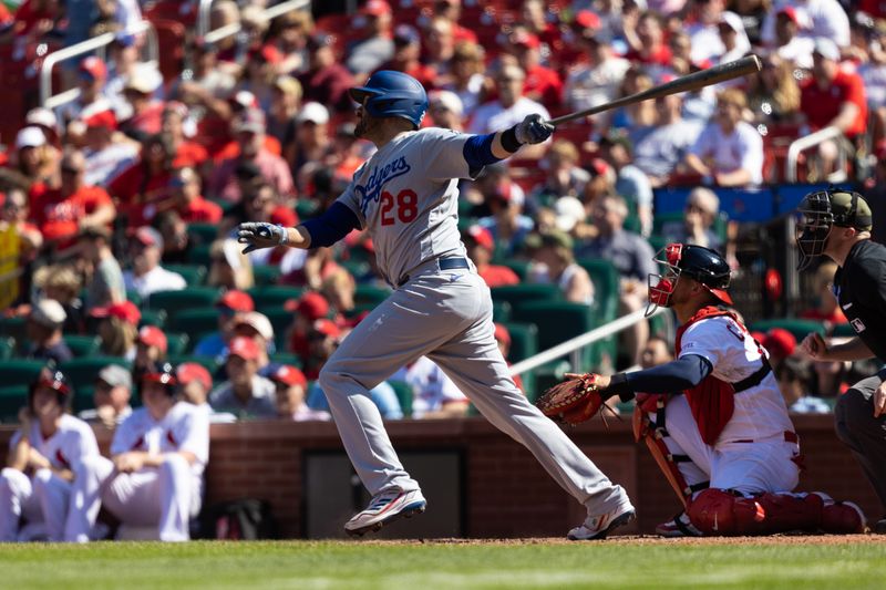 May 21, 2023; St. Louis, Missouri, USA; Los Angeles Dodger designated hitter, J.D. Martinez (28) hits an RBI single in the seventh inning against the St. Louis Cardinals at Busch Stadium. Mandatory Credit: Zach Dalin-USA TODAY Sports