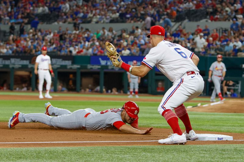 Jun 7, 2023; Arlington, Texas, USA; St. Louis Cardinals third baseman Nolan Arenado (28) is tagged out by Texas Rangers third baseman Josh Jung (6) during the fifth inning at Globe Life Field. Mandatory Credit: Andrew Dieb-USA TODAY Sports