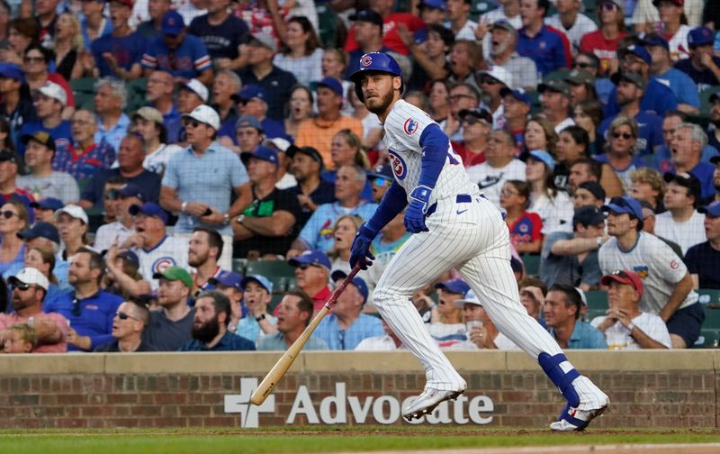 Aug 4, 2024; Chicago, Illinois, USA; Chicago Cubs outfielder Cody Bellinger (24) hits a one run sacrifice against the St. Louis Cardinals during the fifth inning at Wrigley Field. Mandatory Credit: David Banks-USA TODAY Sports