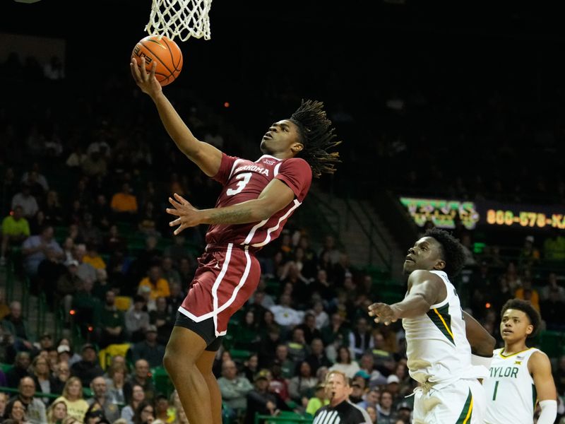 Feb 8, 2023; Waco, Texas, USA;  Oklahoma Sooners guard Otega Oweh (3) scores a layup past Baylor Bears forward Jonathan Tchamwa Tchatchoua (23) during the first half at Ferrell Center. Mandatory Credit: Chris Jones-USA TODAY Sports