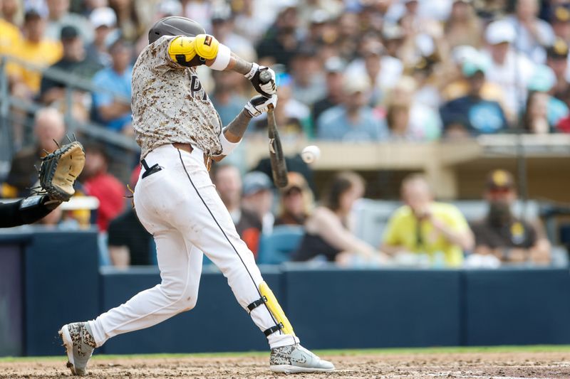 Jun 1, 2025; San Diego, California, USA; San Diego Padres first baseman Luis Arraez (4) hits a rbi single during the seventh inning against the Pittsburgh Pirates at Petco Park. Mandatory Credit: David Frerker-Imagn Images