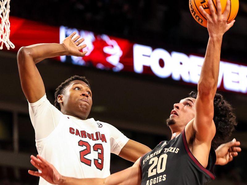 Jan 14, 2023; Columbia, South Carolina, USA; South Carolina Gamecocks forward Gregory Jackson II (23) blocks the shot of Texas A&M Aggies guard Andre Gordon (20) in the second half at Colonial Life Arena. Mandatory Credit: Jeff Blake-USA TODAY Sports