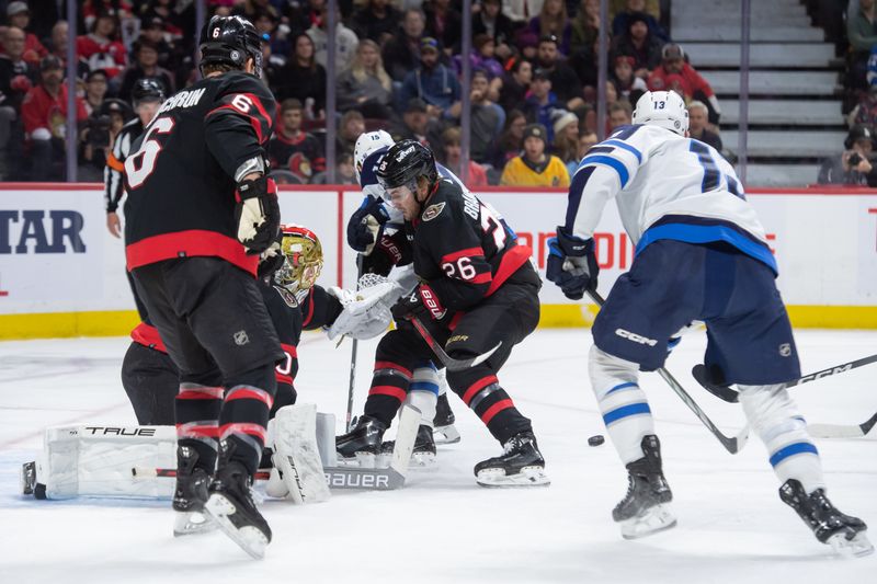 Jan 20, 2024; Ottawa, Ontario, CAN; Ottawa Senators goalie Joonas Korpisalo (70) makes a save on a shot from Winnipeg Jets center Rasmus Kupari (15) in the second period at the Canadian Tire Centre. Mandatory Credit: Marc DesRosiers-USA TODAY Sports