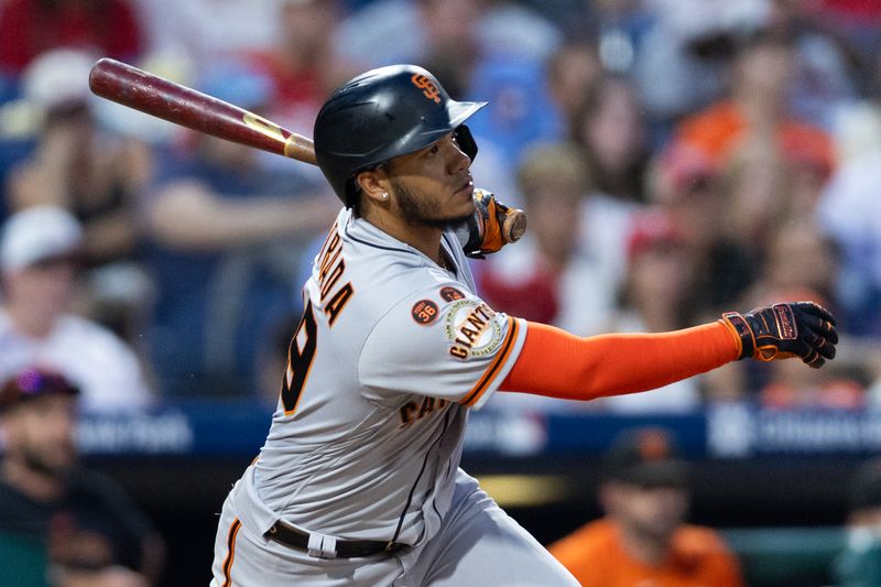 Aug 23, 2023; Philadelphia, Pennsylvania, USA; San Francisco Giants second baseman Thairo Estrada (39) hits an RBI fielder choice during the tenth inning against the Philadelphia Phillies at Citizens Bank Park. Mandatory Credit: Bill Streicher-USA TODAY Sports