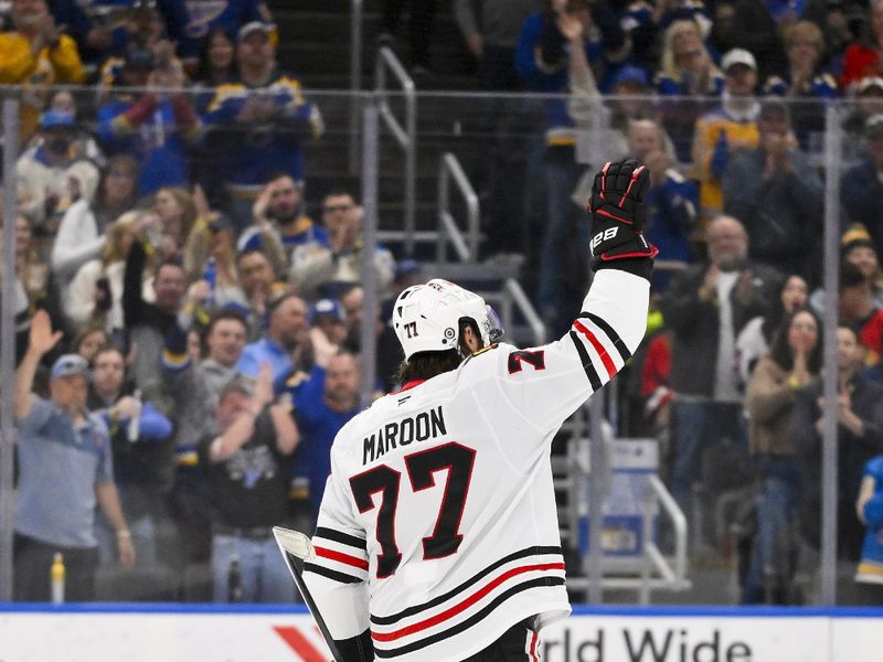 Mar 22, 2025; St. Louis, Missouri, USA;  Chicago Blackhawks left wing Patrick Maroon (77) is acknowledged by the St. Louis Blues and fans during the second period after he announced his retirement before his last game at Enterprise Center. Mandatory Credit: Jeff Curry-Imagn Images