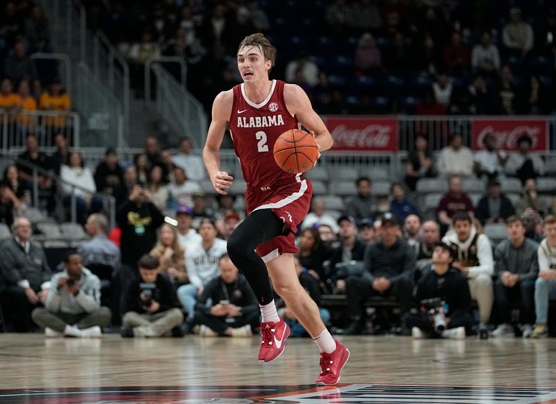 Dec 9, 2023; Toronto, Ontario, CAN; Alabama Crimson Tide forward Grant Nelson (2) dribbles the ball up court against the Purdue Boilermakers during the first half at Coca-Cola Coliseum. Mandatory Credit: John E. Sokolowski-USA TODAY Sports