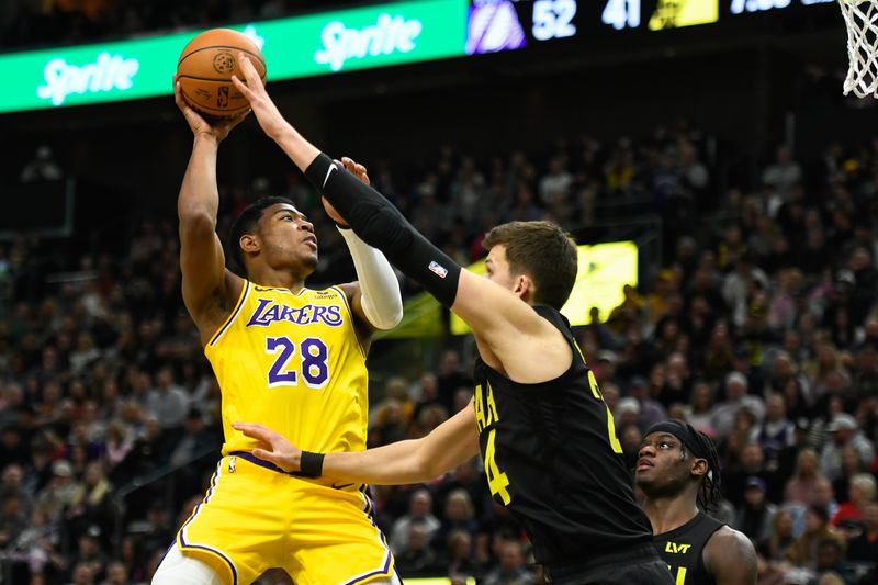 SALT LAKE CITY, UTAH - FEBRUARY 14: Rui Hachimura #28 of the Los Angeles Lakers shoots over Walker Kessler #24 of the Utah Jazz during the first half of a game at Delta Center on February 14, 2024 in Salt Lake City, Utah. NOTE TO USER: User expressly acknowledges and agrees that, by downloading and or using this photograph, User is consenting to the terms and conditions of the Getty Images License Agreement. (Photo by Alex Goodlett/Getty Images)