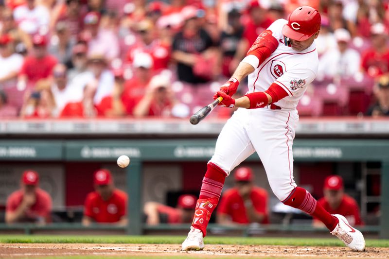 Aug 9, 2023; Cincinnati, OH, USA; Cincinnati Reds first baseman Joey Votto (19) hits a base hit in the second inning of the MLB baseball game between Cincinnati Reds and Miami Marlins at Great American Ball Park in Cincinnati on Wednesday, Aug. 9, 2023.  Mandatory Credit: Albert Cesare-USA TODAY Sports