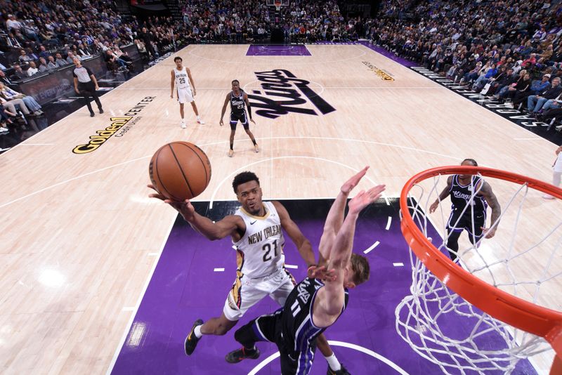 SACRAMENTO, CA - FEBRUARY 8:  Yves Missi #21 of the New Orleans Pelicans drives to the basket during the game against the Sacramento Kings on February 8, 2025 at Golden 1 Center in Sacramento, California. NOTE TO USER: User expressly acknowledges and agrees that, by downloading and or using this Photograph, user is consenting to the terms and conditions of the Getty Images License Agreement. Mandatory Copyright Notice: Copyright 2025 NBAE (Photo by Rocky Widner/NBAE via Getty Images)