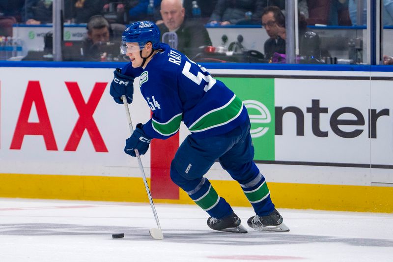 Sep 24, 2024; Vancouver, British Columbia, CAN; Vancouver Canucks forward Aatu Raty (54) handles the puck against the Seattle Kraken during the second period at Rogers Arena. Mandatory Credit: Bob Frid-Imagn Images